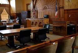 Red wood table and red chair in the justice court